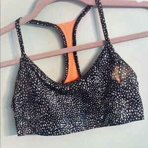 Black and White Spotted Sports Bra with Orange Accent